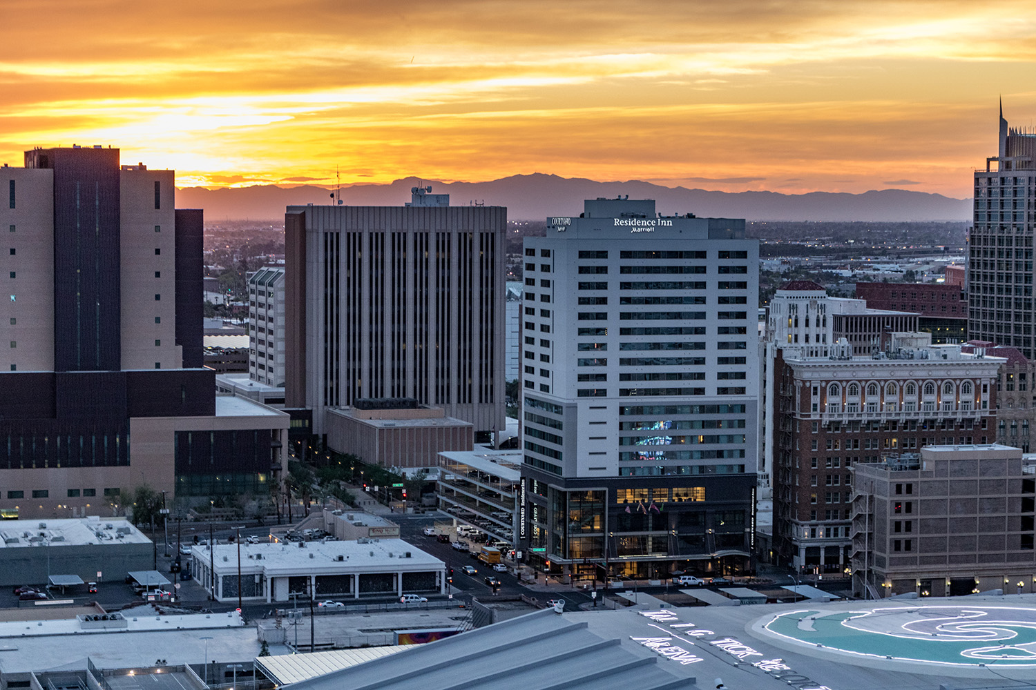 The sun sets over the skyscrapers of downtown Phoenix